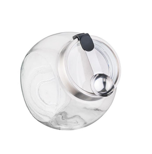 Glasbehälter mit Edelstahldeckel und Löffel.
