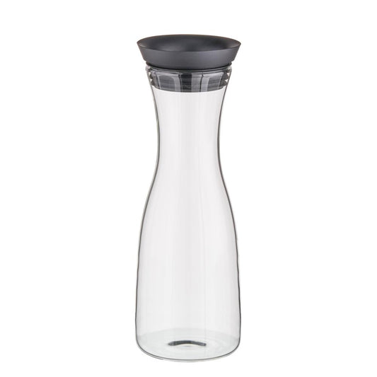 Glaskaraffe mit schwarzem Deckel.
