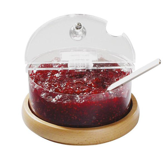 Marmeladenspender mit Holzuntersetzer.