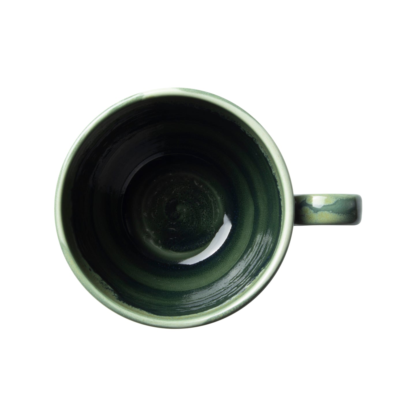 Grüne Tasse von oben fotografiert.