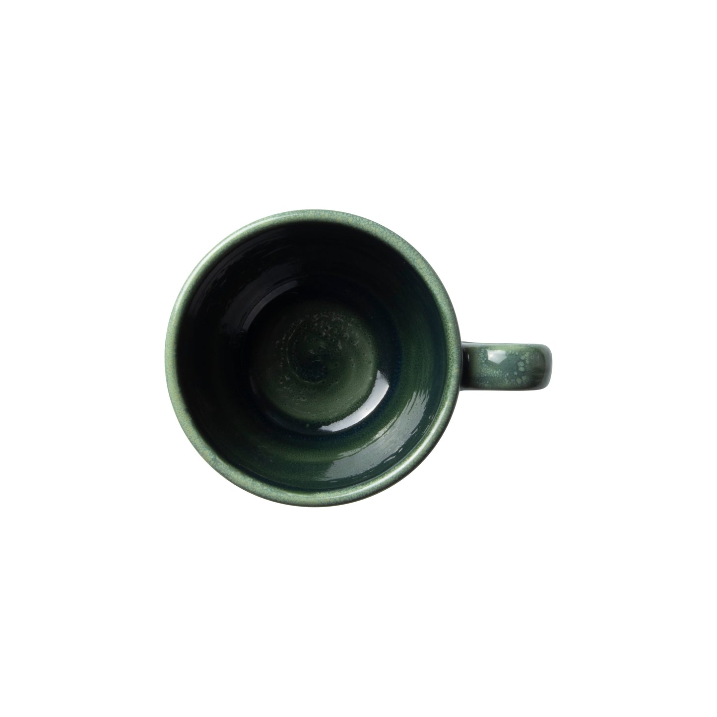 Grüne Tasse von oben fotografiert.