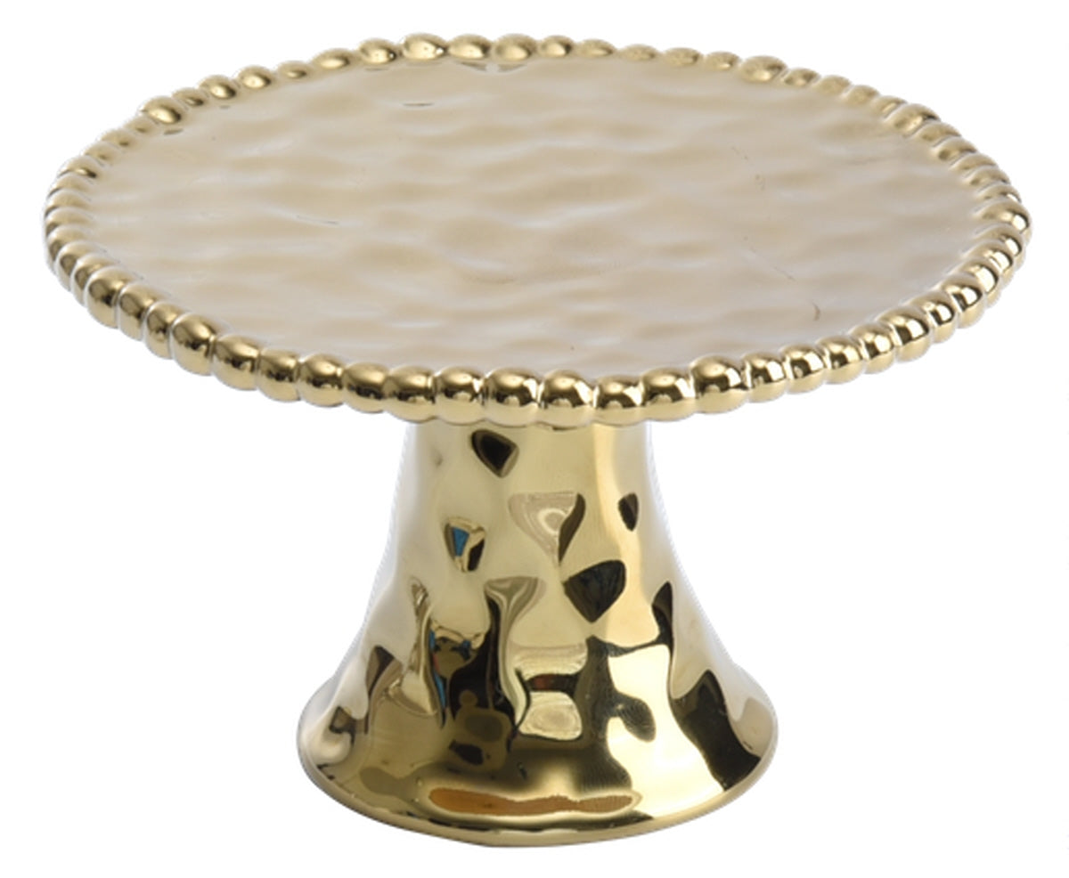 Goldene Kuchenplatte auf Ständer