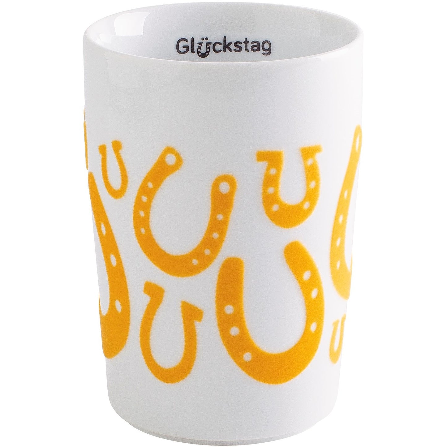 Tasse mit gelben Hufeisen-Motiven.