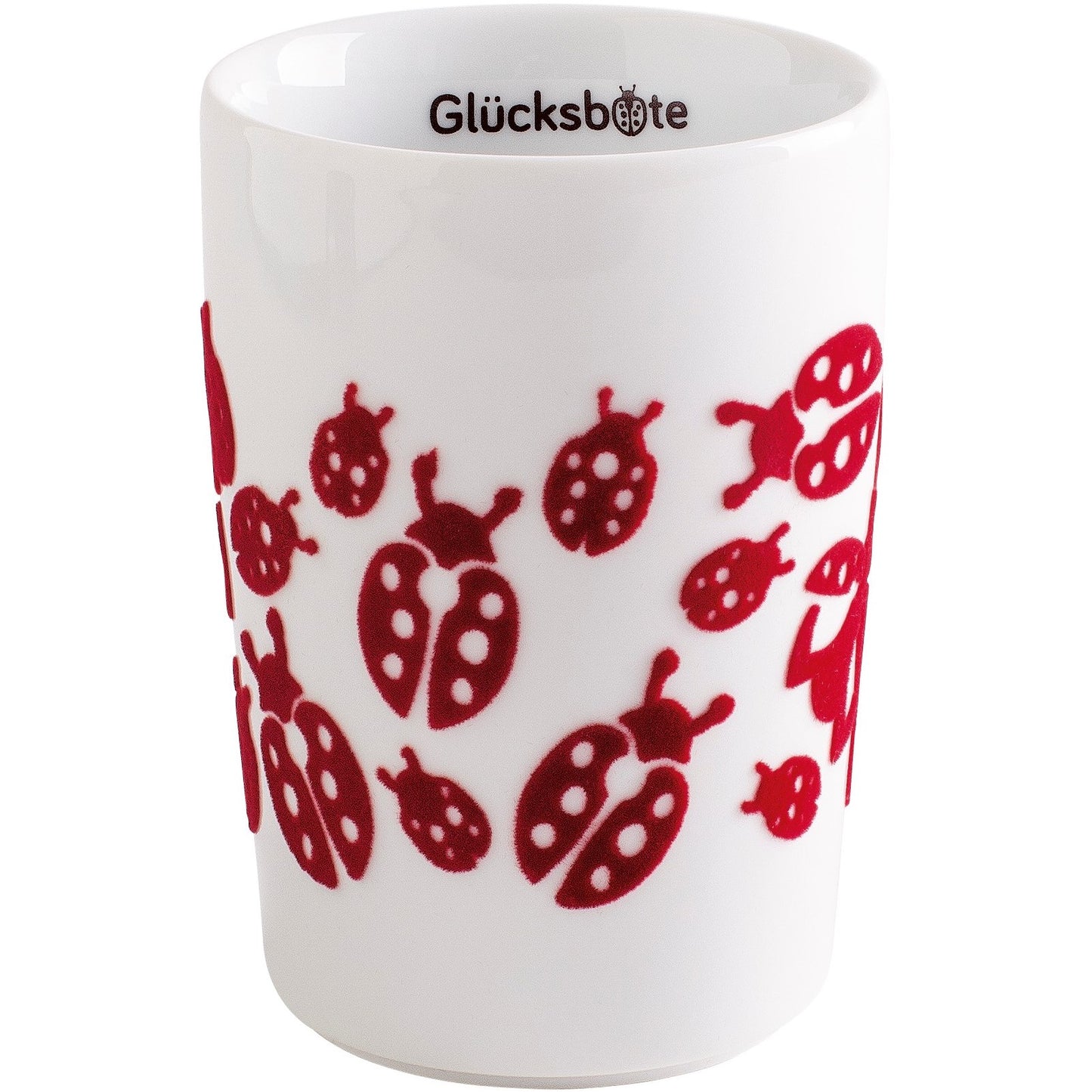 Weiße Tasse mit Marienkäfern.