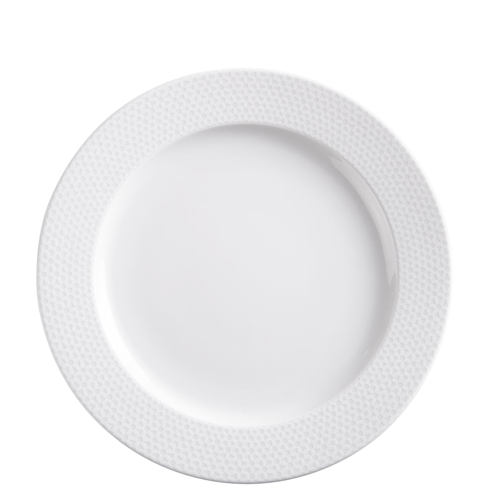 Weißer Porzellanteller mit Muster.