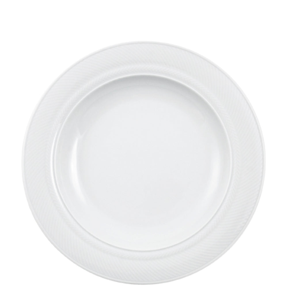 Weißer Porzellanteller mit Muster.