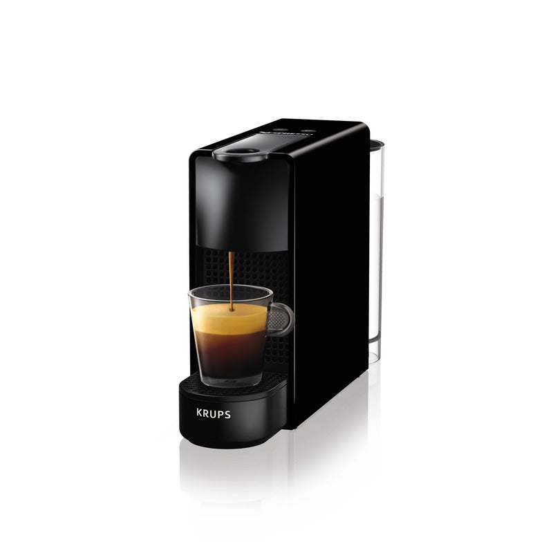 Kaffeemaschine mit gefüllter Tasse.