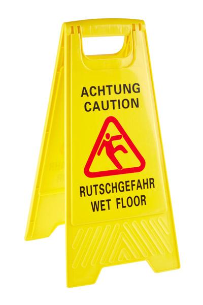 Gelbes Warnschild "Rutschgefahr" aufgestellt.