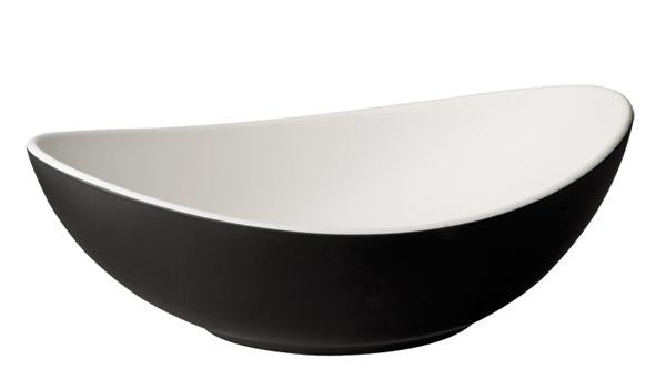 Schwarze, ovale Schale, weiß innen.