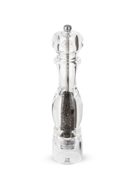 Transparente Pfeffermühle mit Pfefferkörnern.