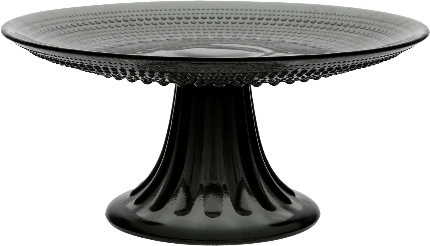 Schwarze Glas-Tortenplatte mit Muster.