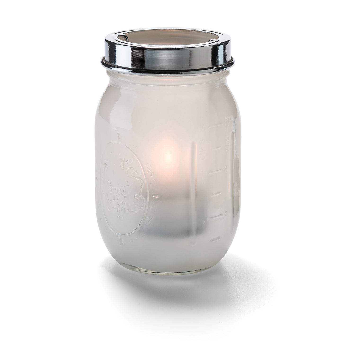 Glas mit Kerze, silberner Deckel.