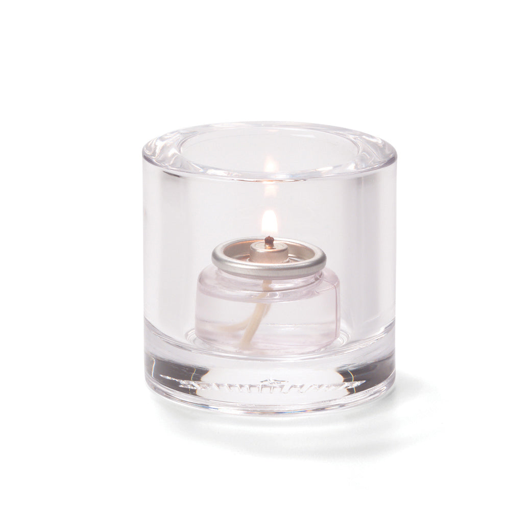 Kleine Tischkerze in Glasbehälter.