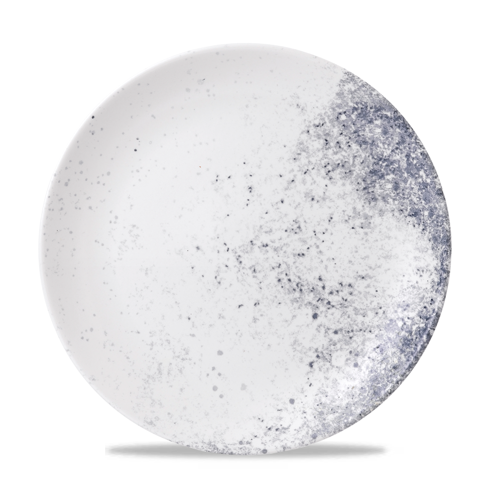 Weißer Teller mit blauen Sprenkeln.