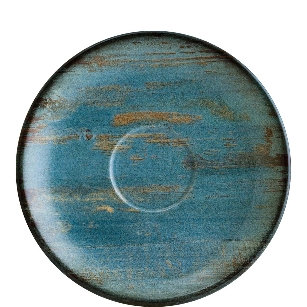 Blauer, rustikaler Teller mit Muster.