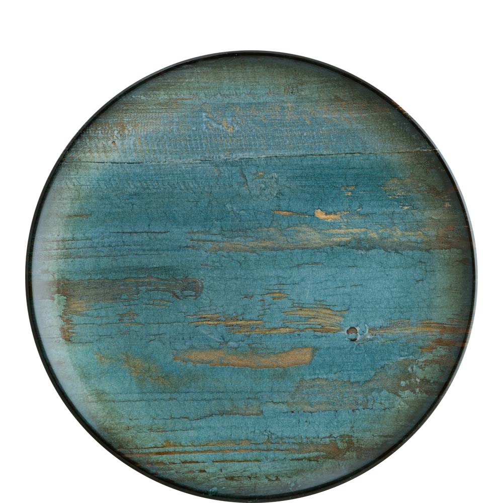 Runder, blauer, rustikaler Teller.