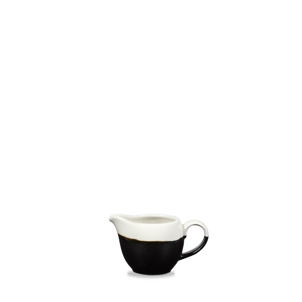 Schwarze und weiße Milchkanne.
