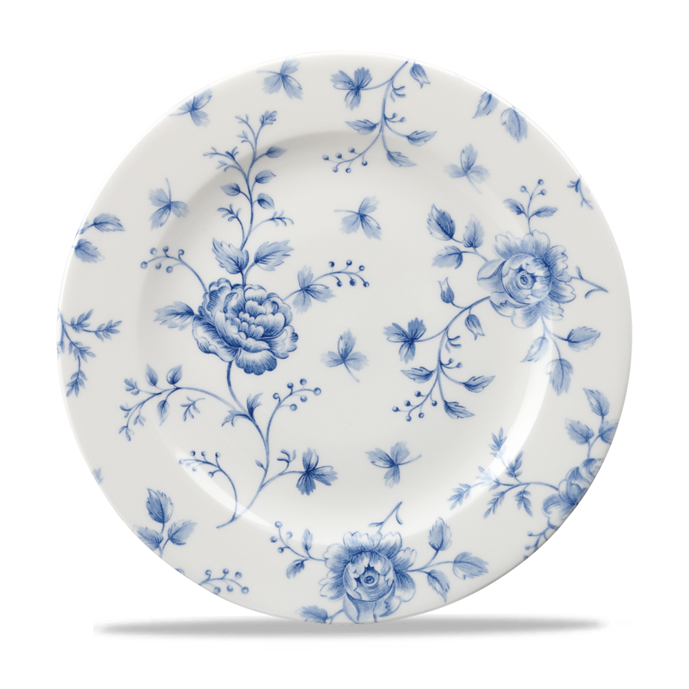 Weißer Teller mit blauen Blumen.