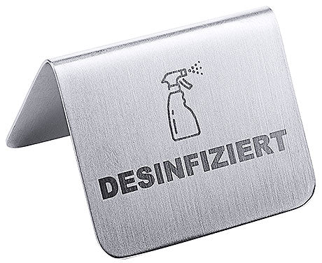 Metallschild mit "Desinfiziert"-Aufschrift.
