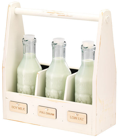 Milchflaschen in Holzträger.