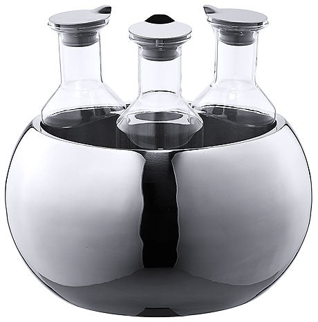 Drei Flaschen in Edelstahlhalterung.