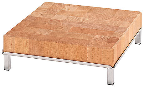 Holzschneidebrett auf Metallfüßen.