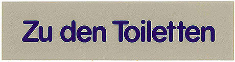 Schild: "Zu den Toiletten"
