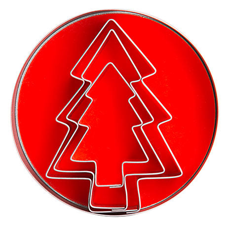 Weihnachtsbaum-Ausstechform auf rotem Hintergrund.
