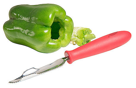 Paprika-Entkerner neben grüner Paprika.