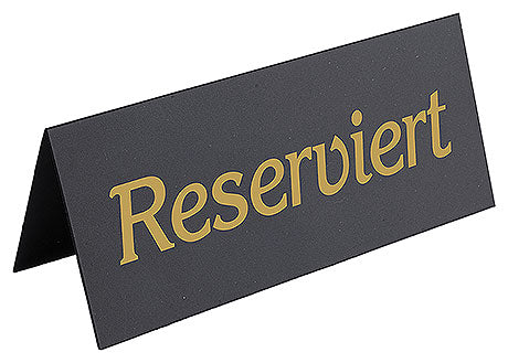 Reserviert-Schild auf Tisch.