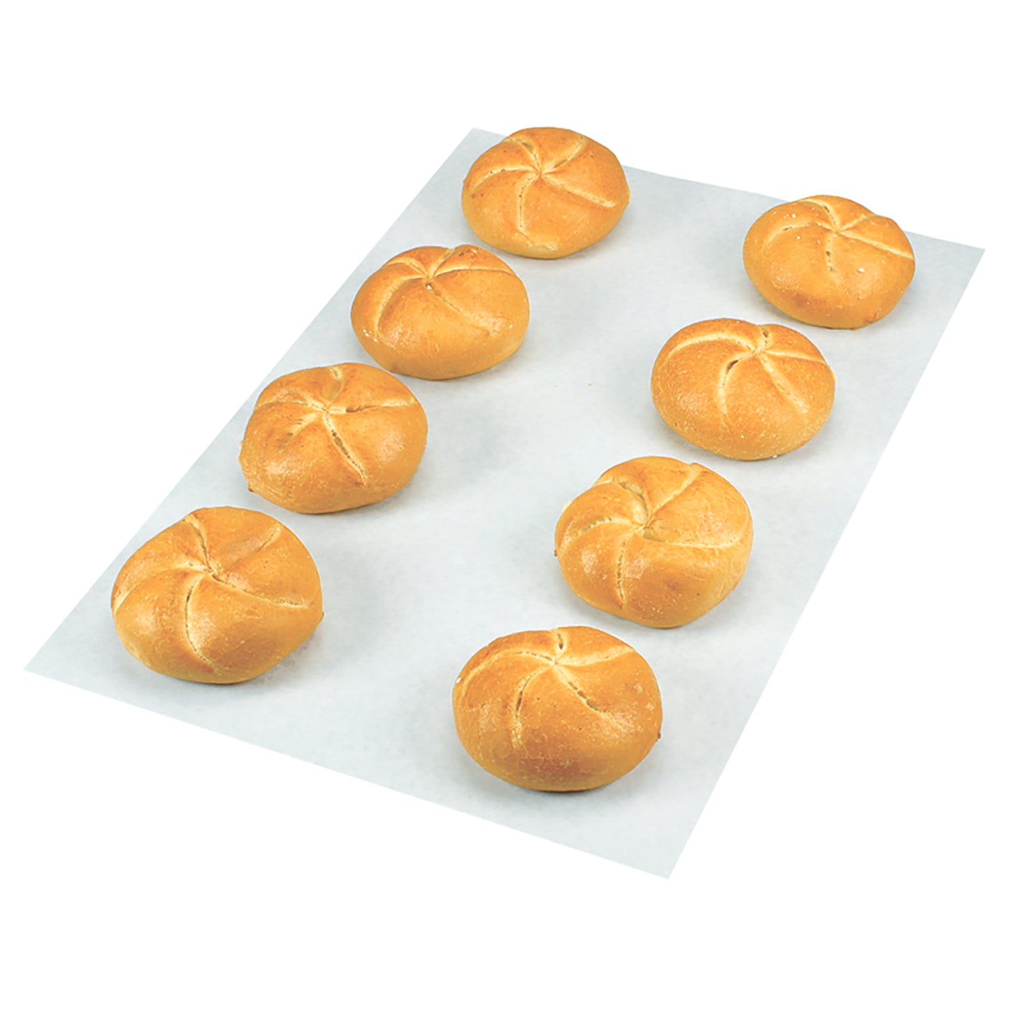 Brötchen auf Backpapier angeordnet.