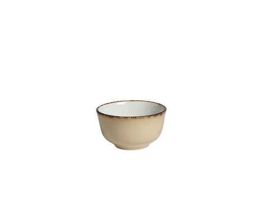 Beige Schüssel mit dunklem Rand.