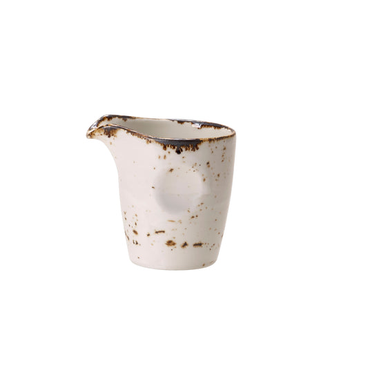 Kleiner, rustikaler Keramik-Milchkännchen.