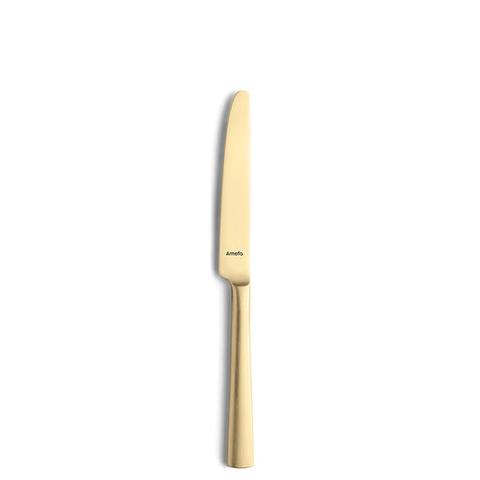 Goldener Küchenmesser auf weißem Hintergrund