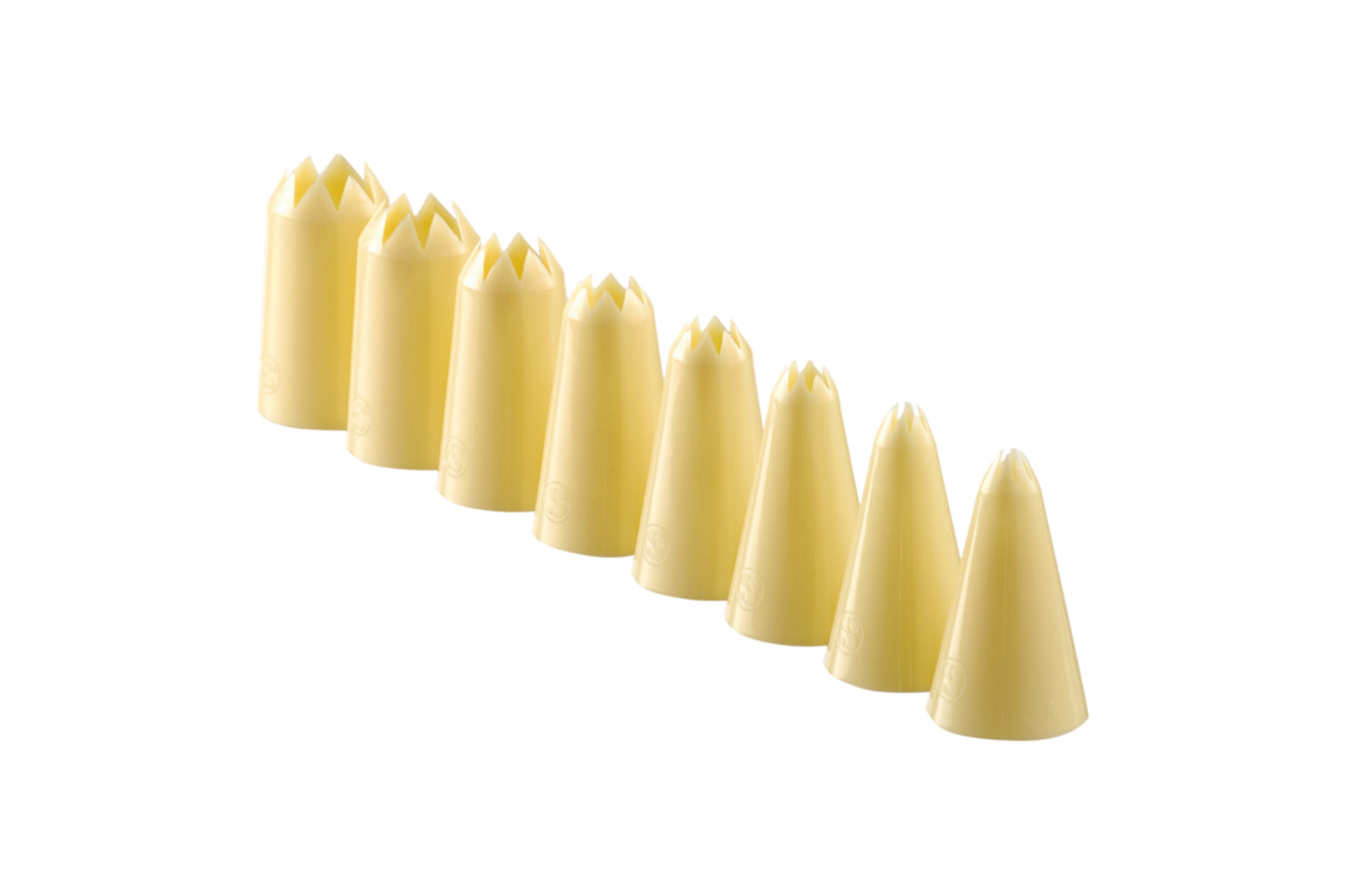 Gelbe Spritzbeutel-Tüllen für Dekoration.