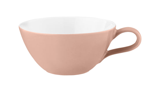 Rosa Kaffeetasse, weiß innen, leer.