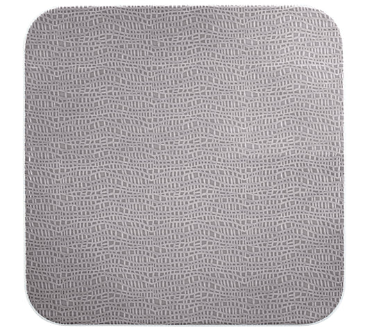 Graues Tablett mit Muster.
