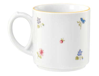 Weiße Tasse mit Blumenmuster.
