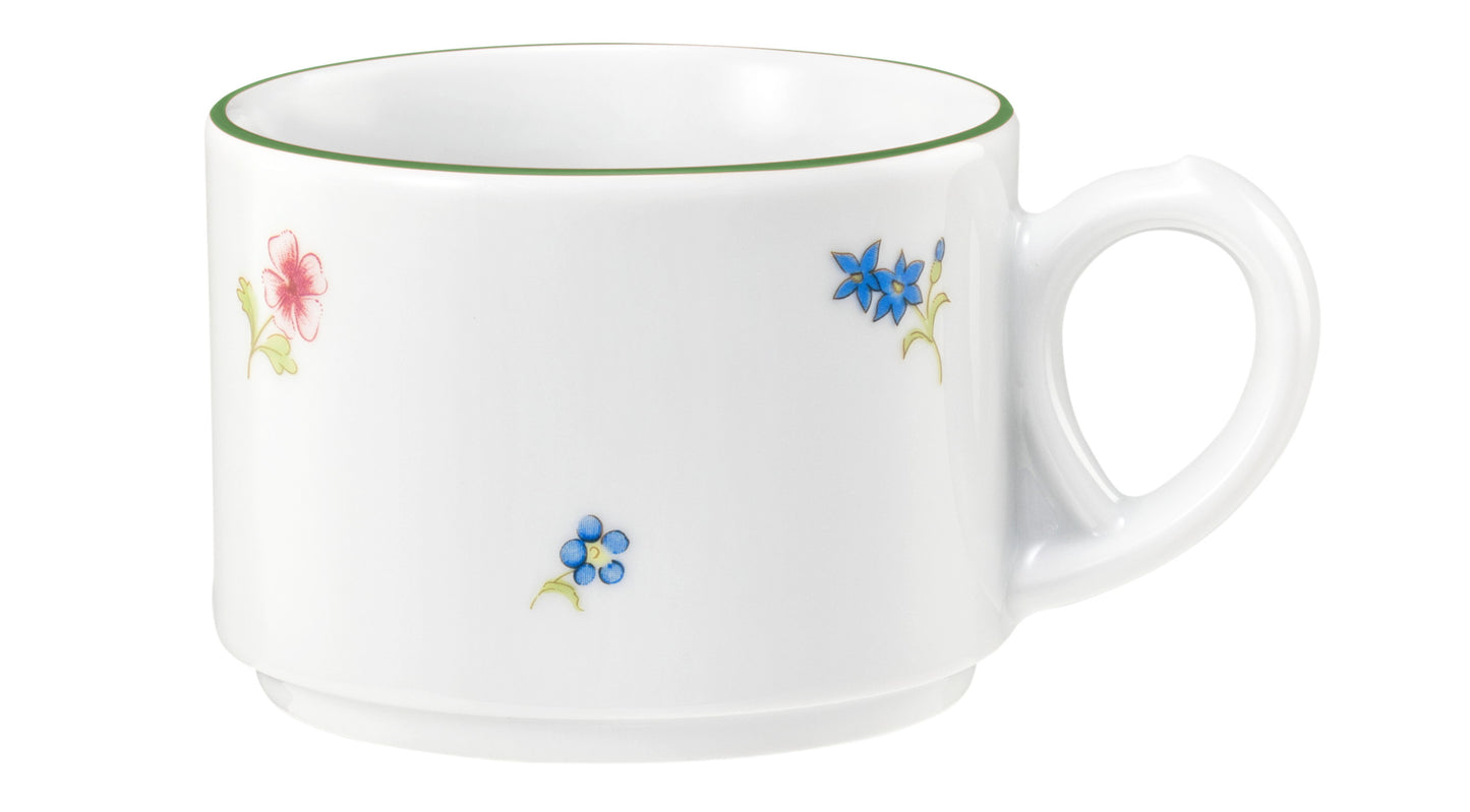 Weiße Tasse mit Blumenmuster.