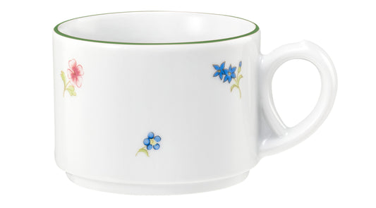 Weiße Tasse mit Blumenmuster.