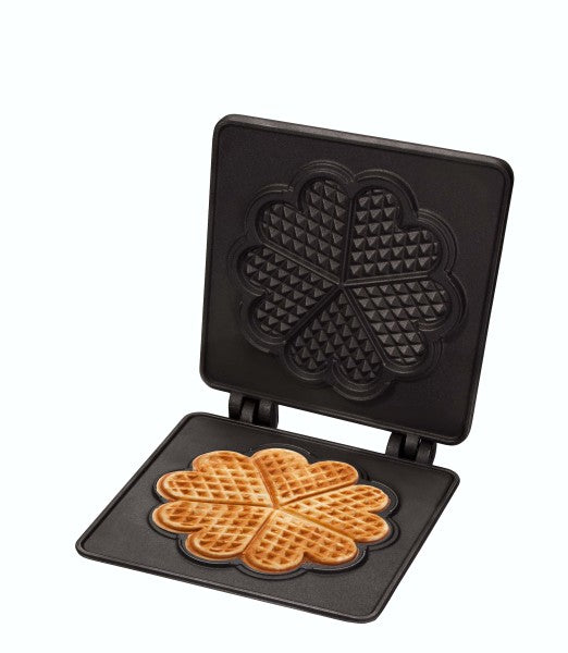 Waffeleisen mit frisch gebackenen Waffeln.