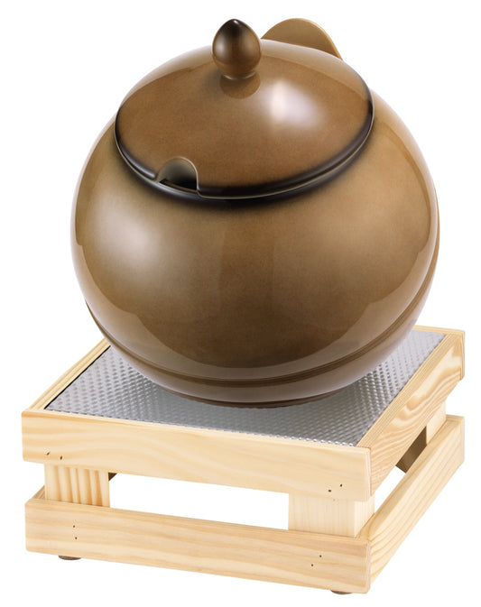 Schokoladenfondue in Schale auf Holzständer