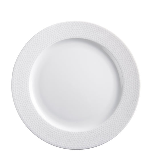 Weißer Porzellanteller mit Muster.