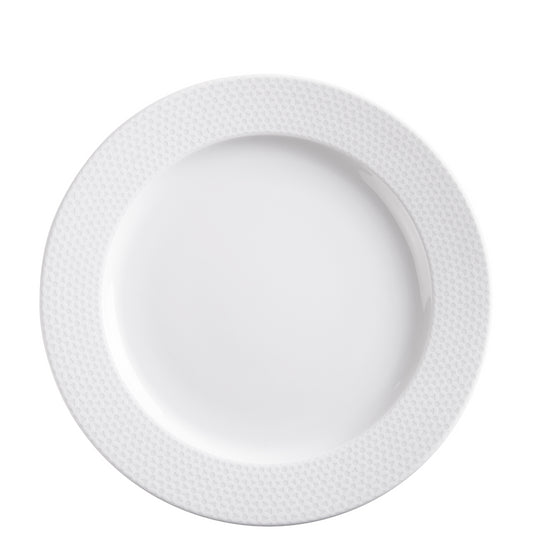 Weißer Porzellanteller mit Muster.