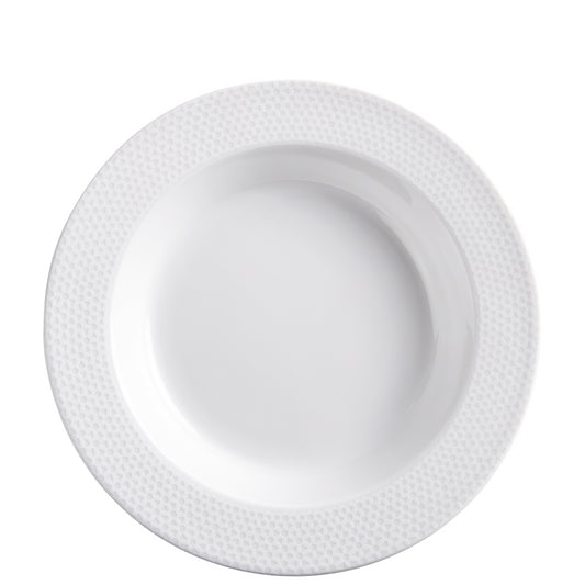 Weißer Porzellanteller mit Muster.