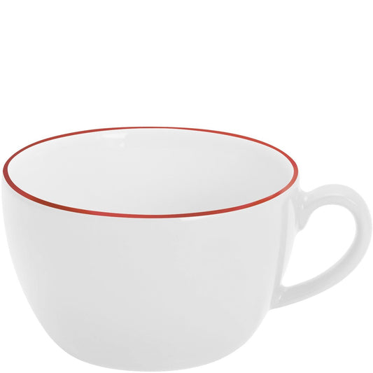 Weiße Tasse mit rotem Rand.