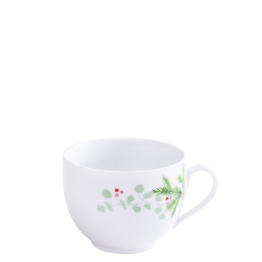 Weiße Tasse mit Pflanzenmuster.