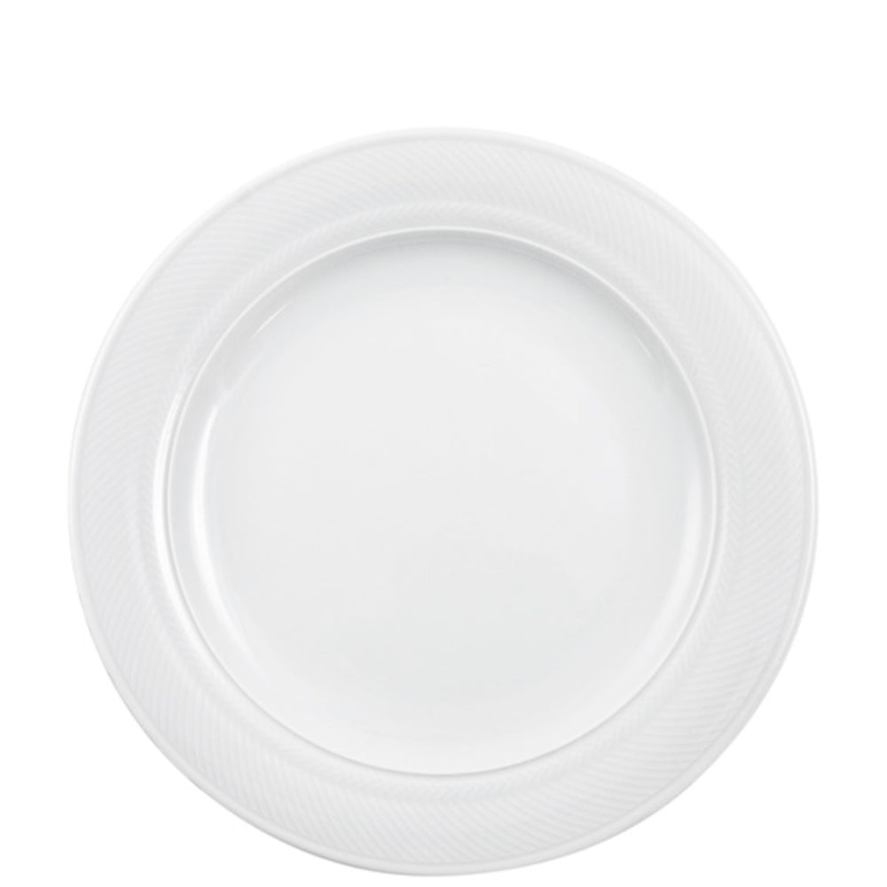 Weißer Porzellanteller mit Muster.