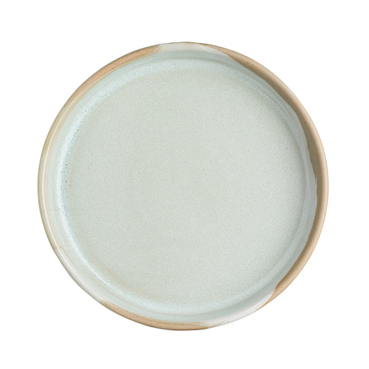 Leerer, runder, weißer Keramikteller.