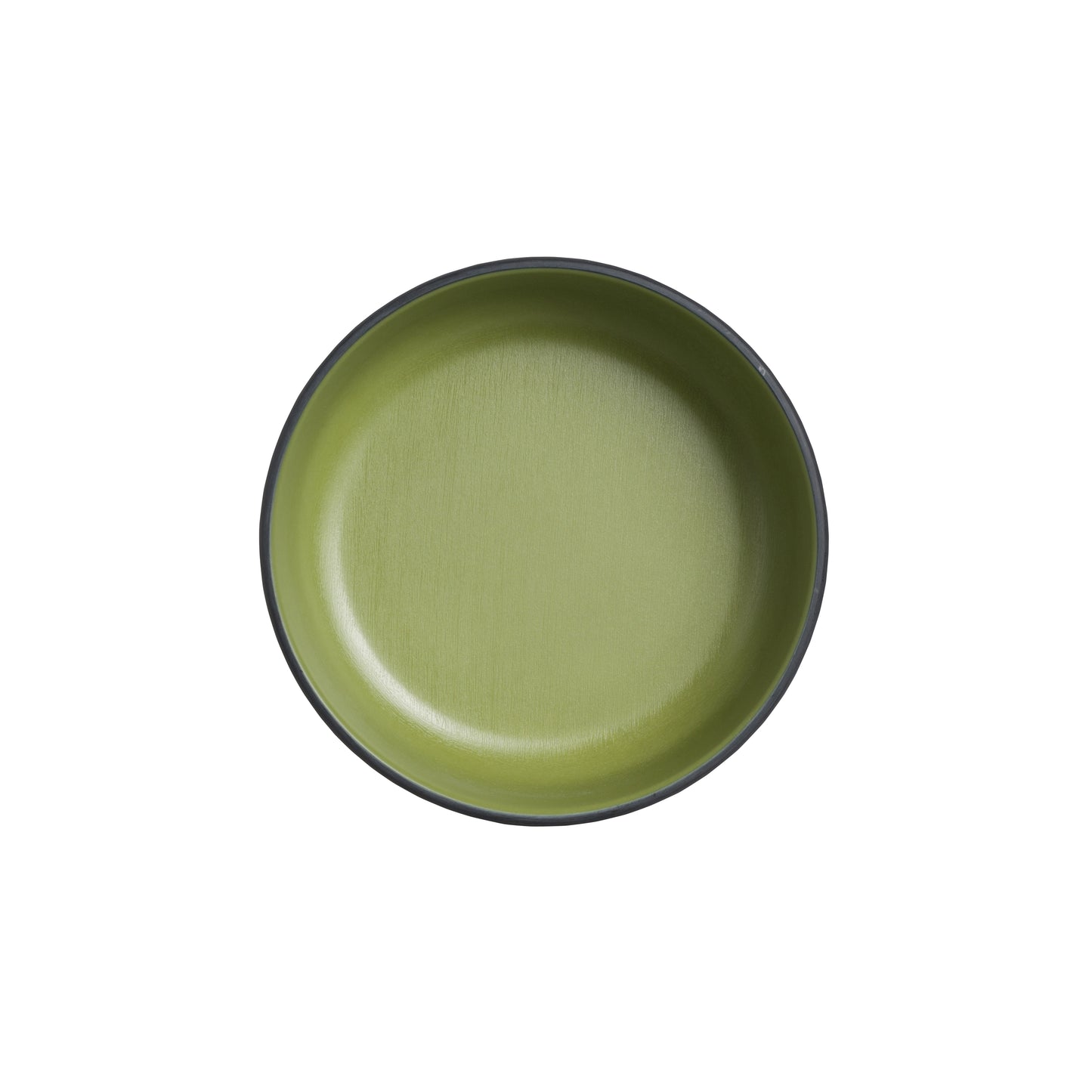 Grüner Teller auf weißem Hintergrund.